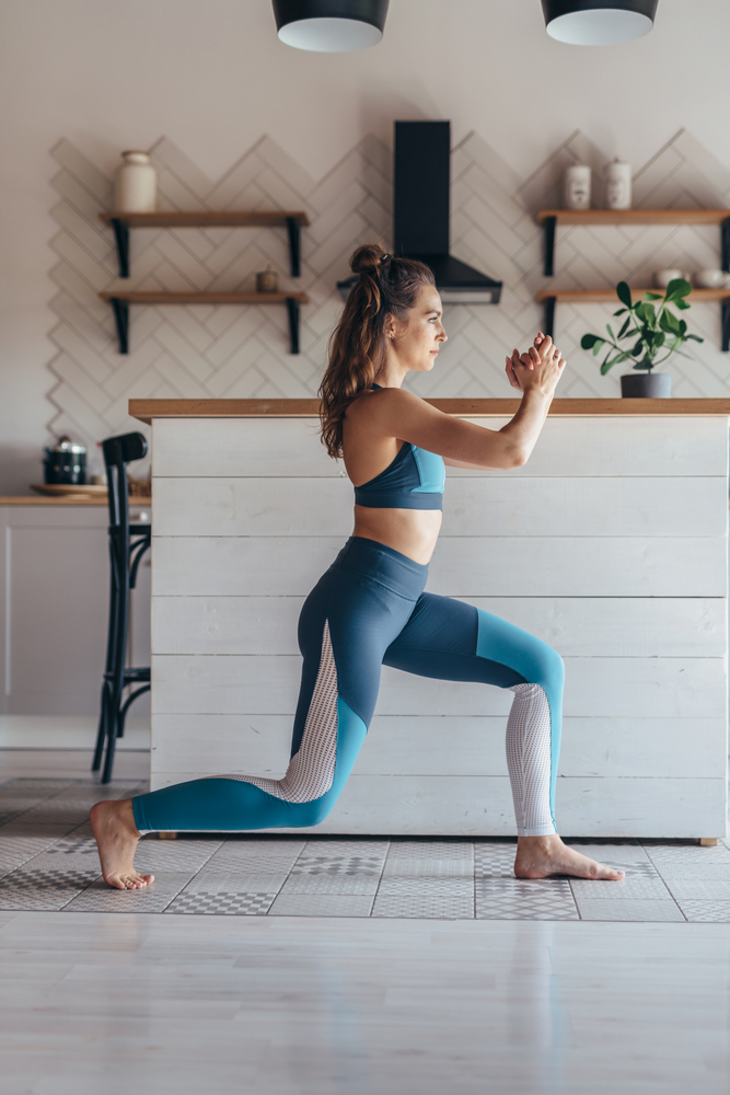 Fit,Woman,Exercising,At,Home,Doing,Lunges,Exercise.