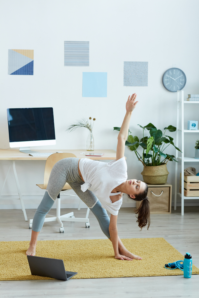 Vertical,Full,Length,Portrait,Of,Contemporary,Young,Woman,Doing,Yoga