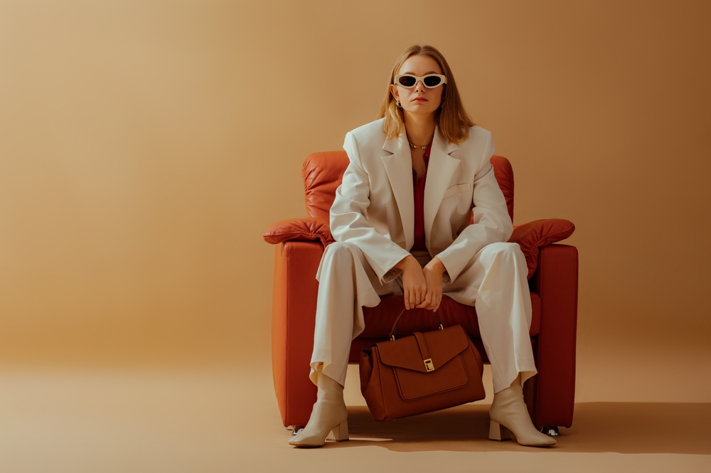 Fashionable,Confident,Woman,Wearing,Elegant,White,Suit,,Sunglasses,,Ankle,Boots,