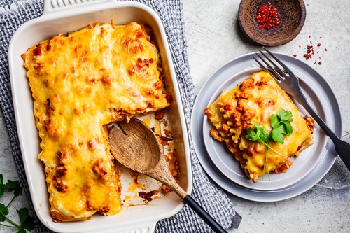 Classic,Meat,Lasagna,With,Cheese,On,A,Light,Gray,Background,