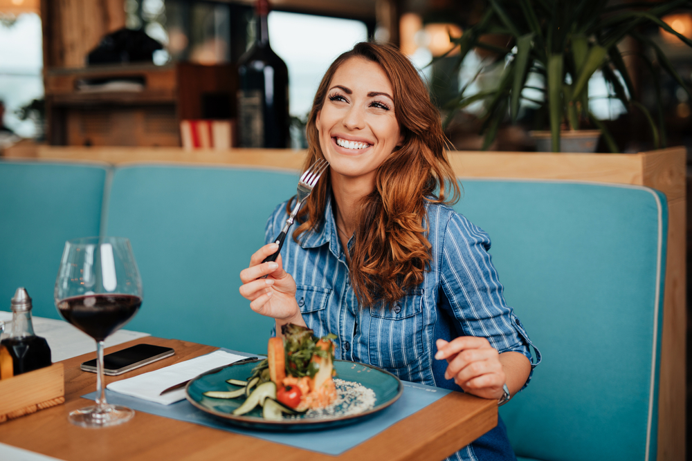 Young,Beautiful,And,Happy,Woman,Enjoying,In,Delicious,Meal,In