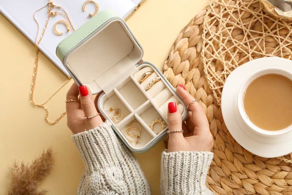 Female,Hands,With,Beautiful,Manicure,Holding,Jewelry,Box,On,Color