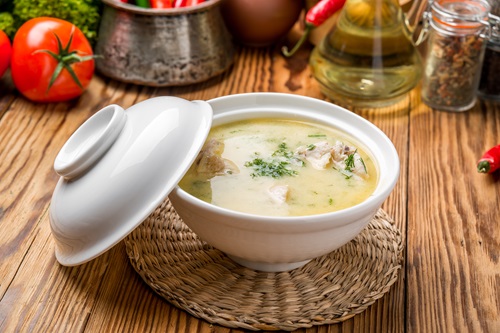 Cheese,Soup,With,Chicken,And,Vegetables,In,A,Plate
