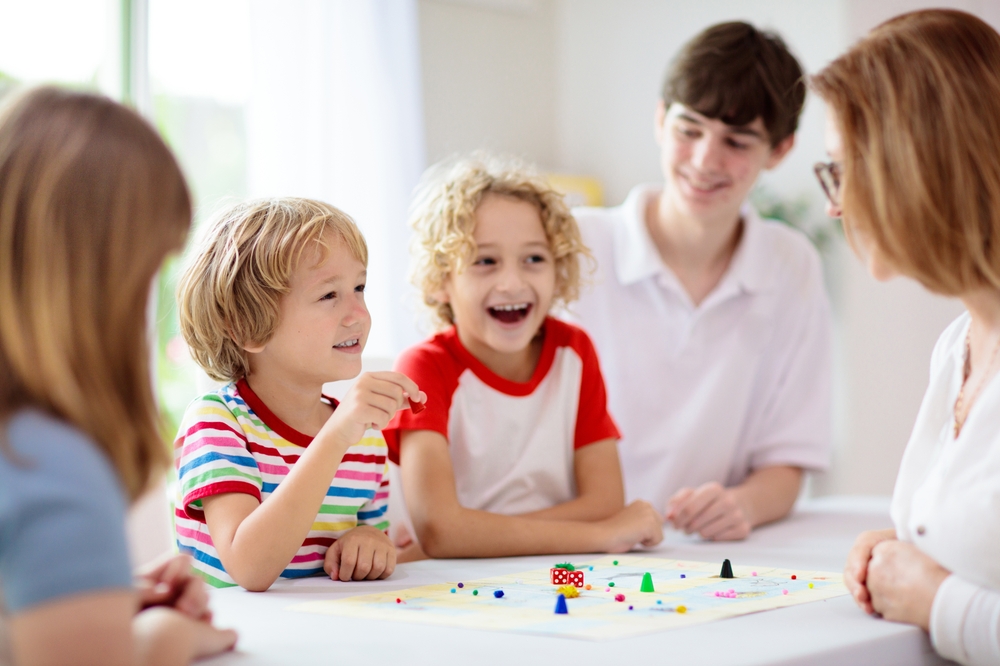 Family,Playing,Board,Game,At,Home.,Kids,Play,Strategic,Game.