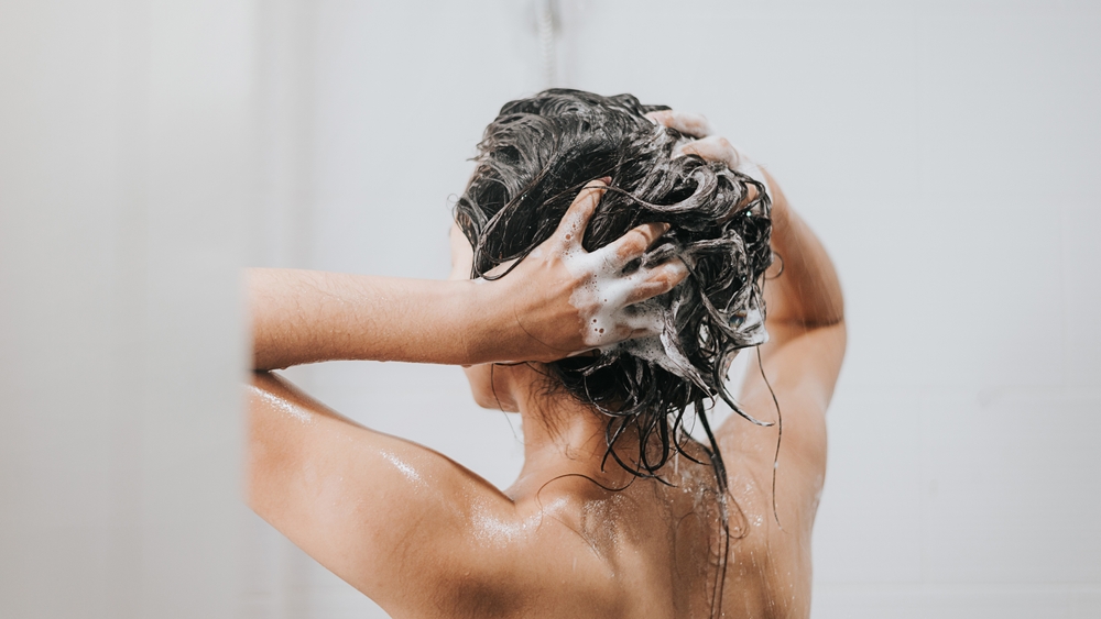 Woman,Washing,Hair,With,Shampoo,And,Shower,In,Bathroom,,Asian