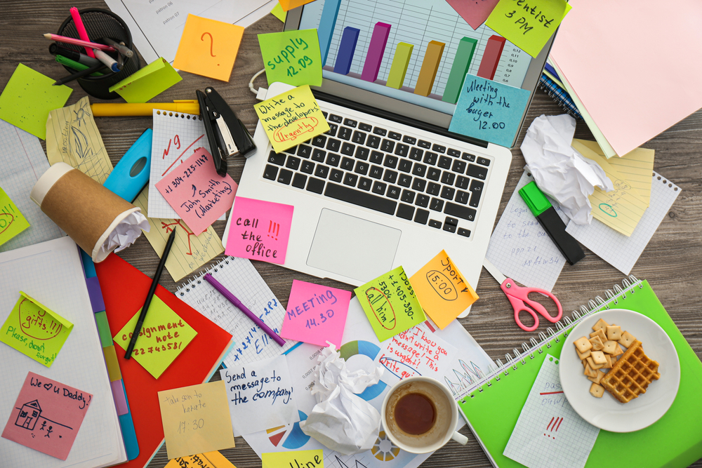 Laptop,,Notes,And,Office,Stationery,In,Mess,On,Desk,,Top
