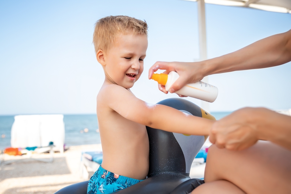 Mother,Applying,Sunscreen,Protection,Creme,On,Cute,Little,Baby,Boy