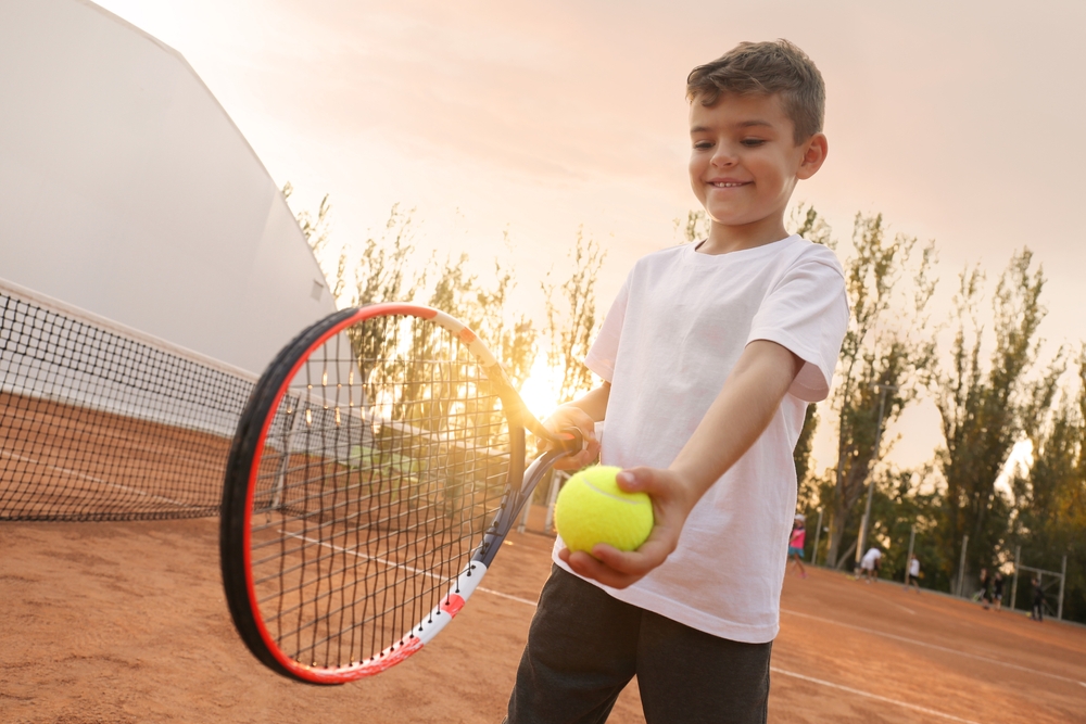 Cute,Little,Boy,Playing,Tennis,On,Court,Outdoors