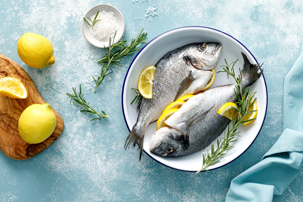 Fresh,Raw,Dorado,Fish,Cooking,With,Lemon,And,Rosemary.,Sea