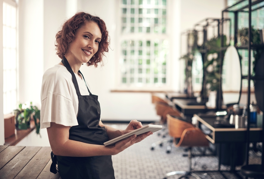 Smile,,Portrait,And,Woman,With,Tablet,At,Hair,Salon,For