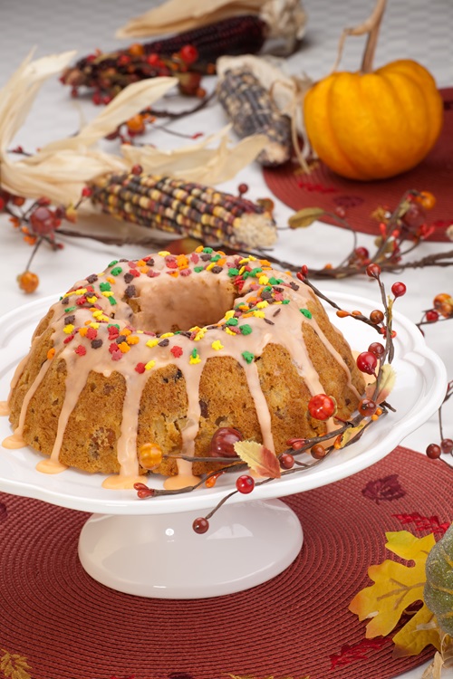 Fall,Cake,With,Autumn,Leaves,Sprinkles,Over,Citrus,Icing,,Decorated