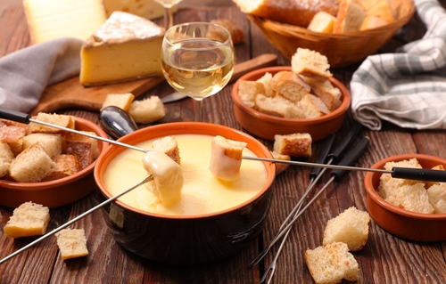 Traditional,Cheese,Fondue,With,Bread,And,Glass,Of,Wine