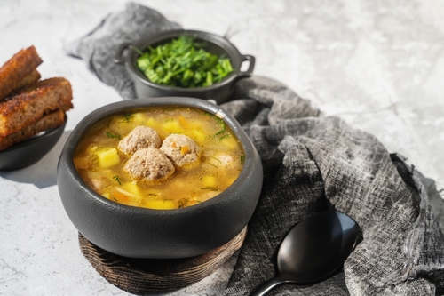 Meatball,Soup,In,A,Black,Bowl.,A,European,Dish,Typical