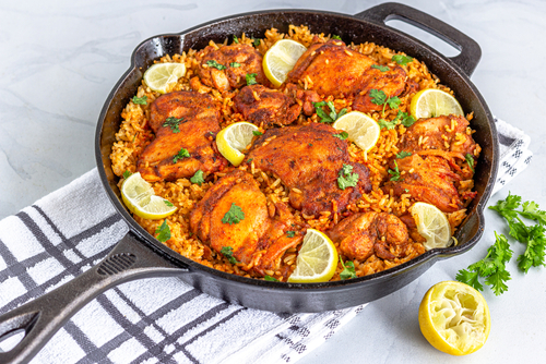 One,Pan,Chicken,And,Rice,In,A,Skillet,Garnished,With