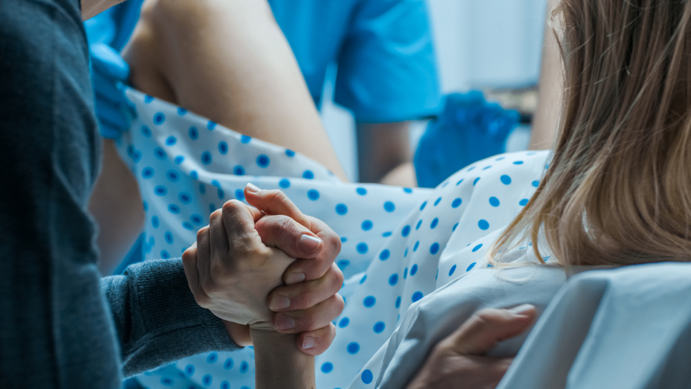 Emergency,In,The,Hospital:,Woman,Giving,Birth,,Husband,Holds,Her